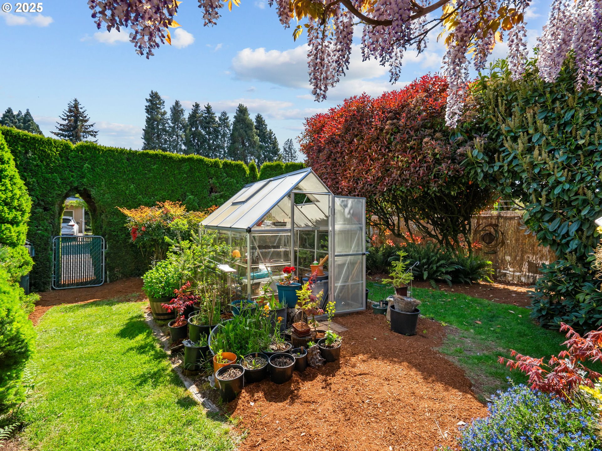 4355 Bren Loop Northeast Salem, OR 97305 - Photo 35 of 44 a front view of a house with a yard and a garden