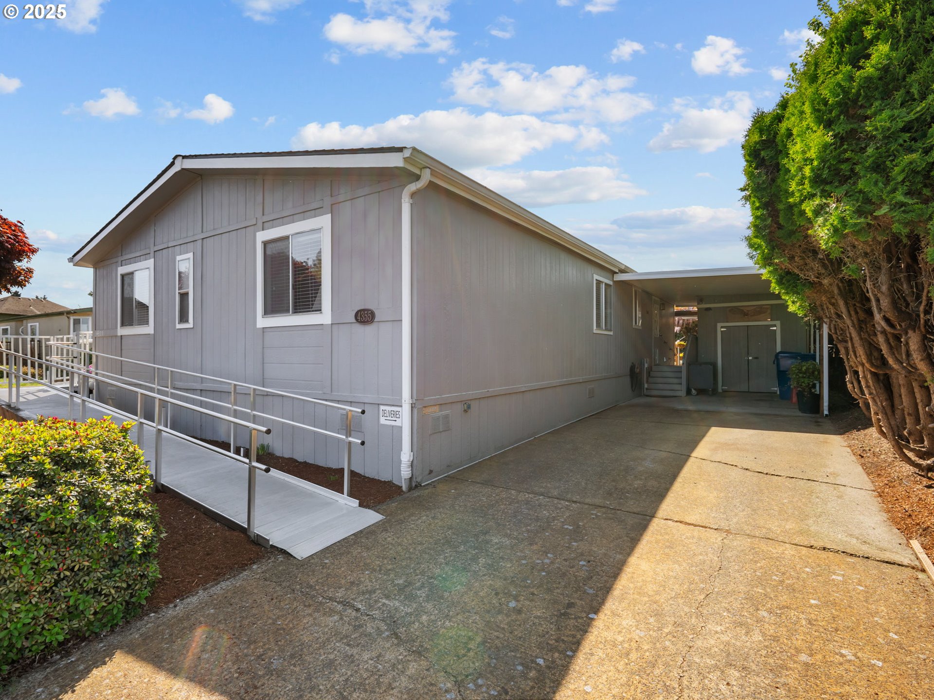 4355 Bren Loop Northeast Salem, OR 97305 - Photo 43 of 44 a yellow house with a outdoor space