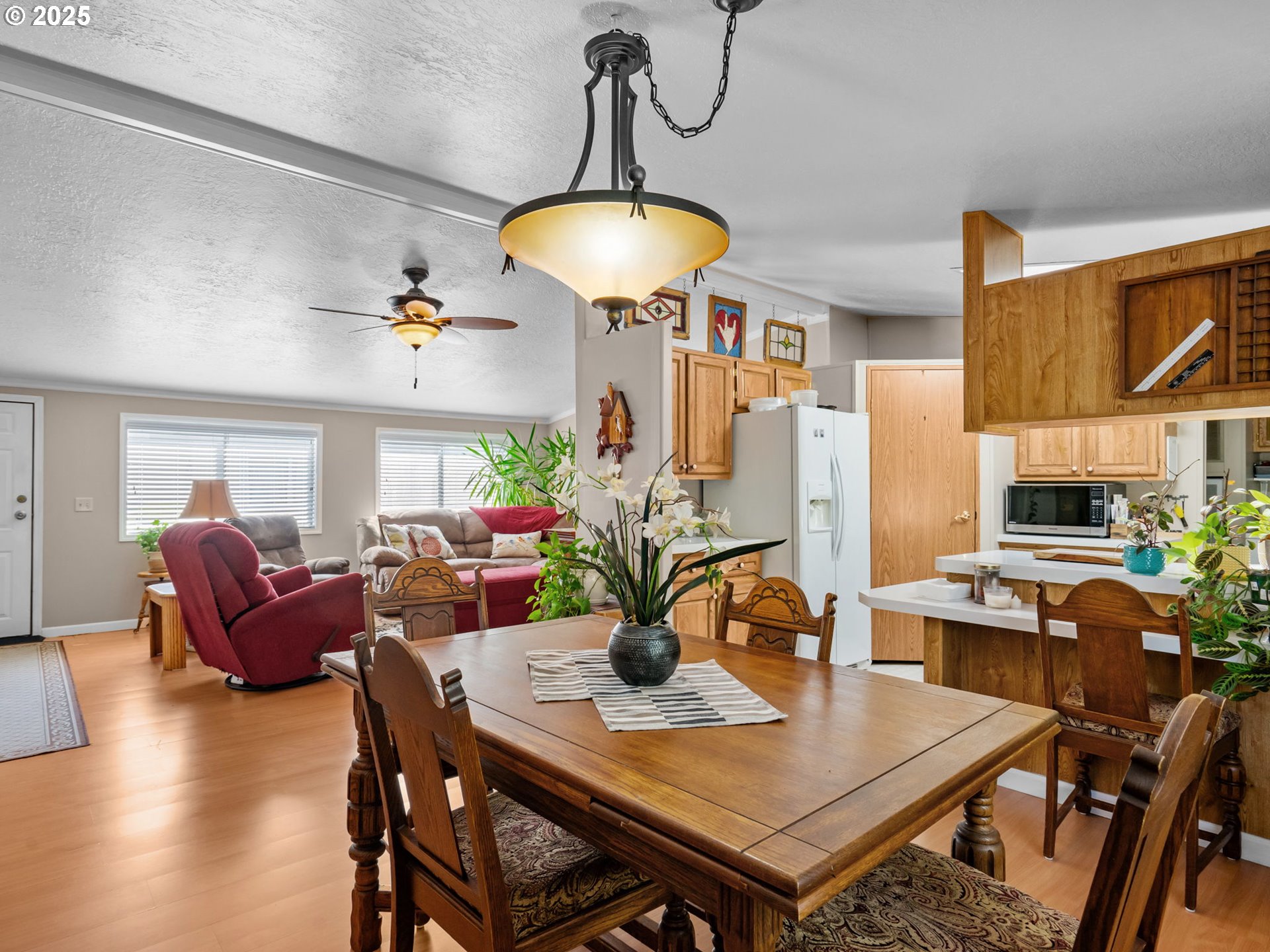 4355 Bren Loop Northeast Salem, OR 97305 - Photo 8 of 44 a view of a dining room with furniture and wooden floor