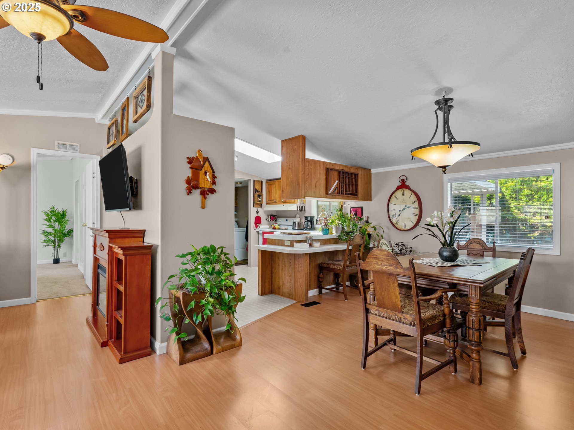 4355 Bren Loop Northeast Salem, OR 97305 - Photo 9 of 44 a view of a dining room and kitchen with furniture window and wooden floor