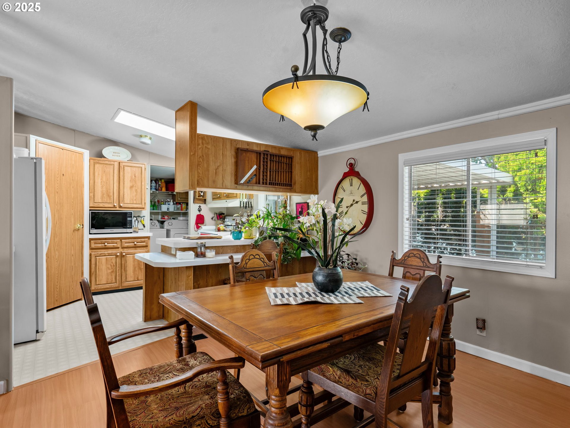 4355 Bren Loop Northeast Salem, OR 97305 - Photo 10 of 44 a view of a dining room with furniture window and wooden floor