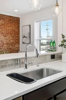 a kitchen with a sink and a window