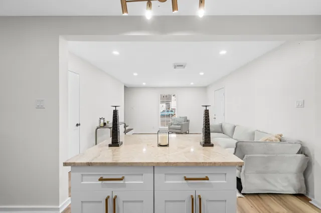 a living room with furniture and a rug
