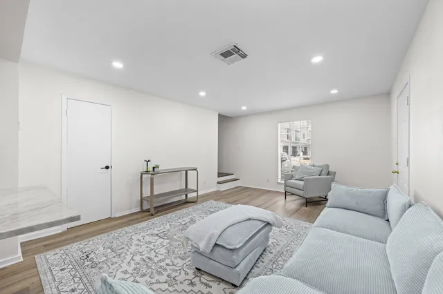a living room with furniture and a couch