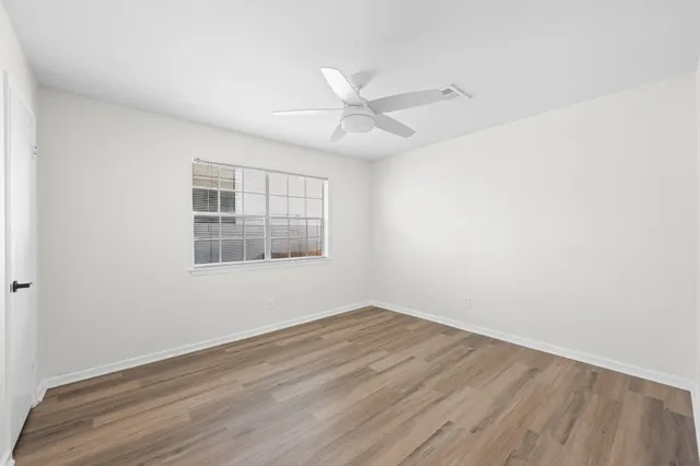 a bathroom with a double vanity sink toilet and a mirror
