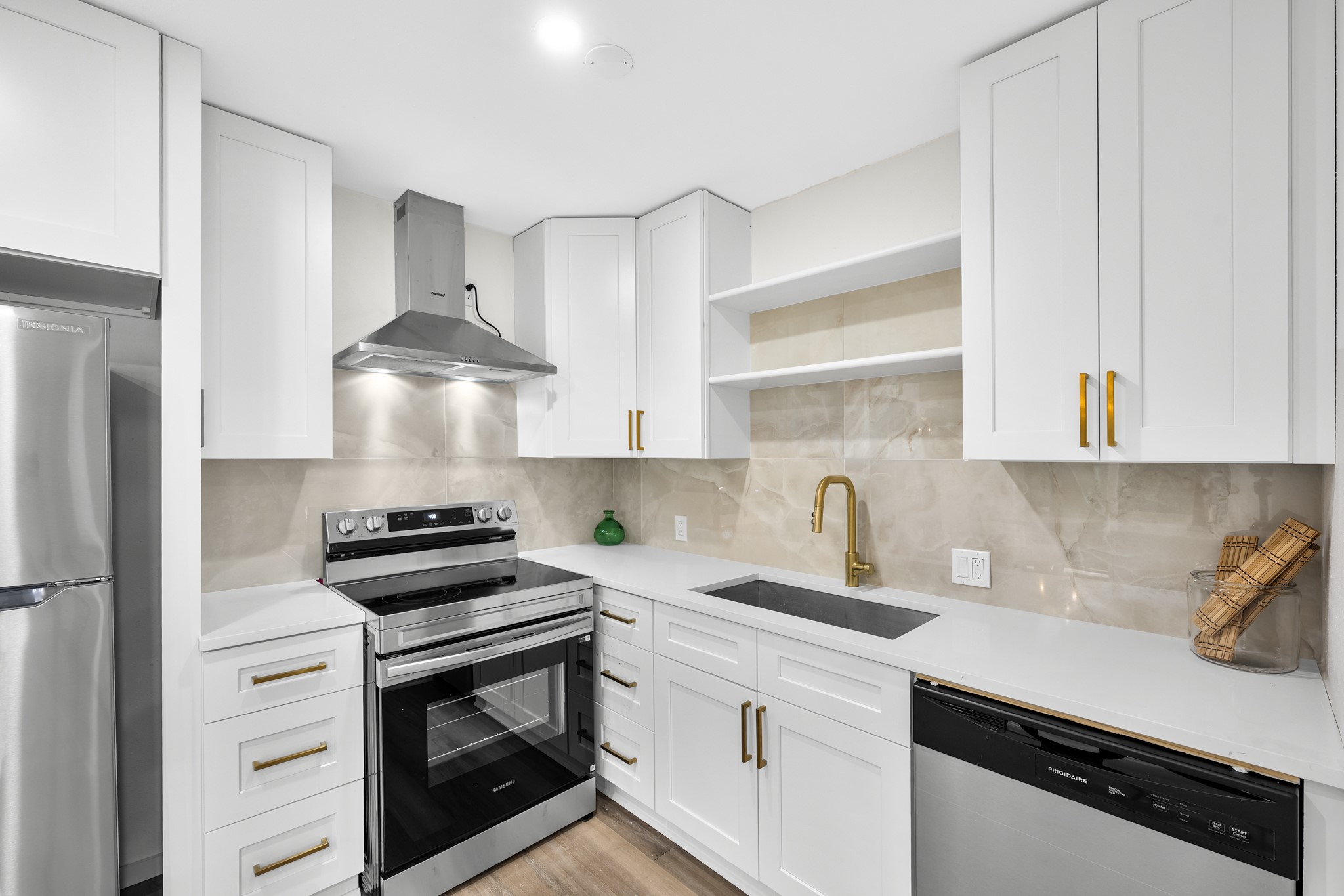 2012 Brun Street, Unit A Houston, TX 77019 - Photo 5 of 16 a kitchen with stainless steel appliances a stove a sink and a refrigerator