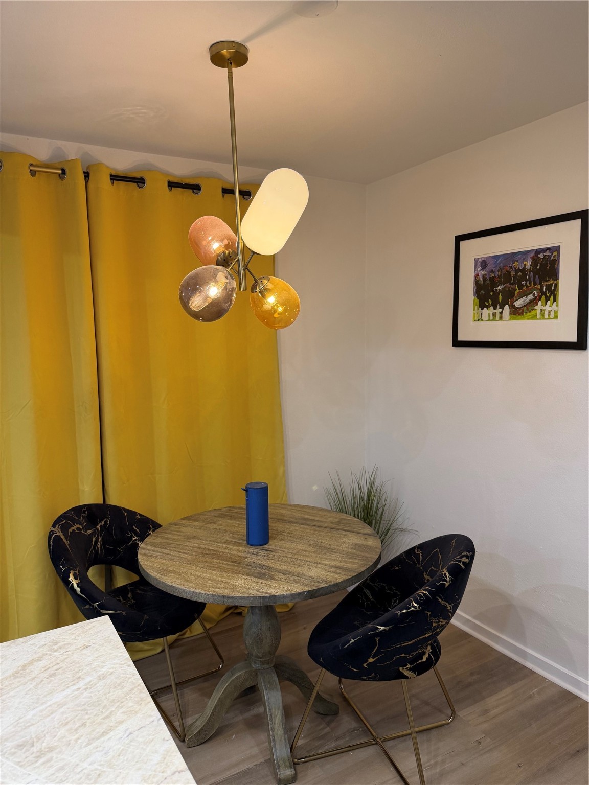 2012 Brun Street, Unit A Houston, TX 77019 - Photo 7 of 16 a view of a dining room with a table and chairs