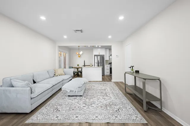 a view of a porch with potted plants
