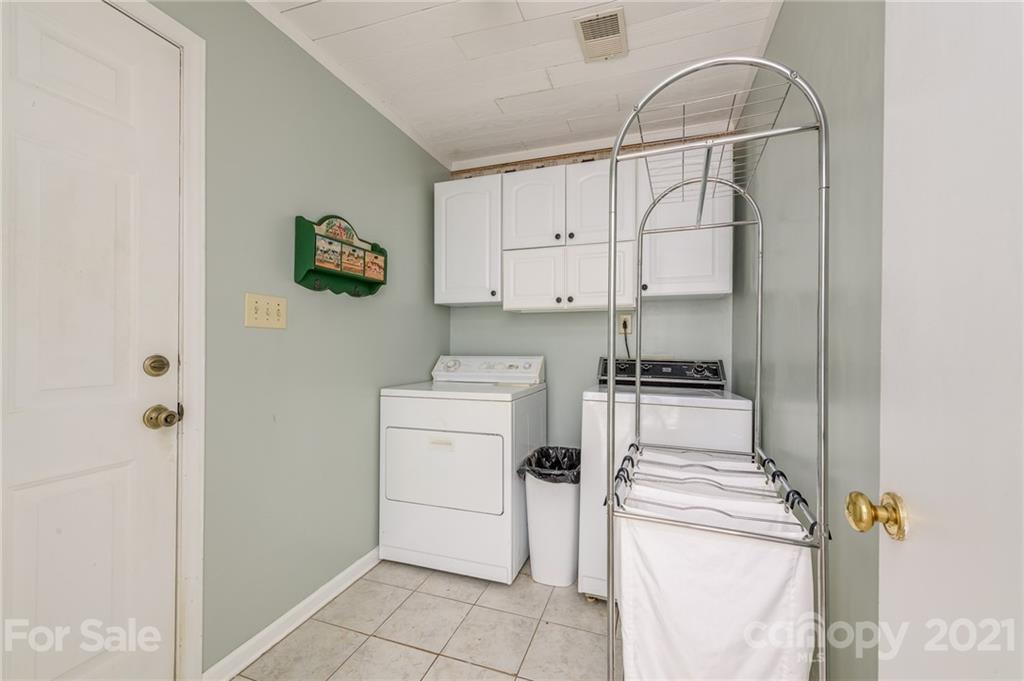 7335 Reedy Creek Road, Unit 25 Charlotte, NC 28215 - Photo 14 of 28 a utility room with dryer and washer