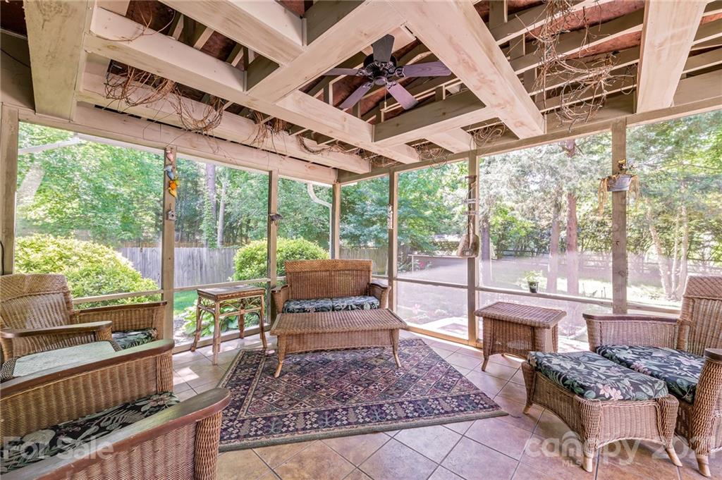 7335 Reedy Creek Road, Unit 25 Charlotte, NC 28215 - Photo 22 of 28 a living room with large windows