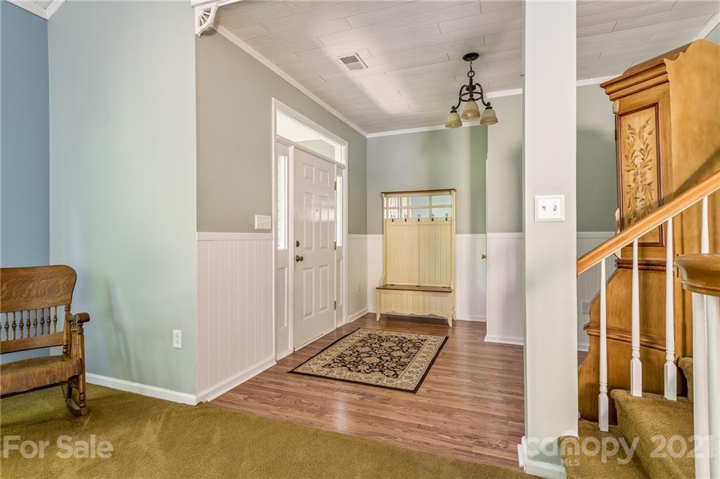 7335 Reedy Creek Road, Unit 25 Charlotte, NC 28215 - Photo 4 of 28 a view of room with window and wooden floor