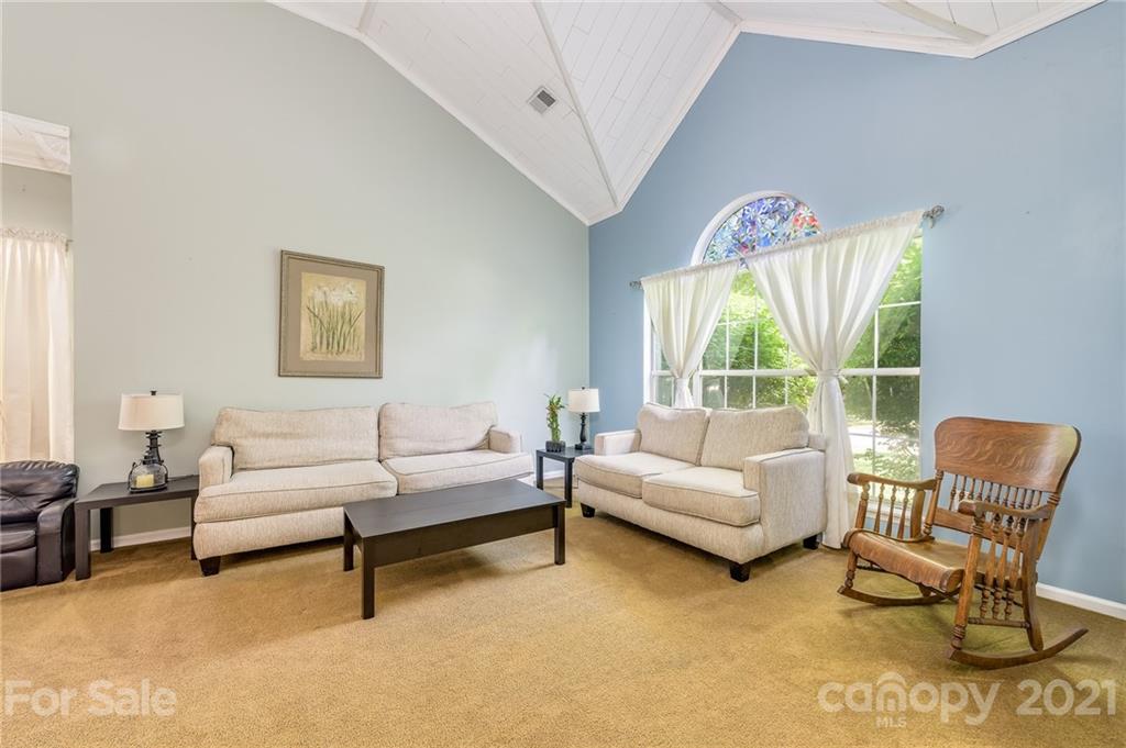 7335 Reedy Creek Road, Unit 25 Charlotte, NC 28215 - Photo 5 of 28 a living room with furniture and a large window