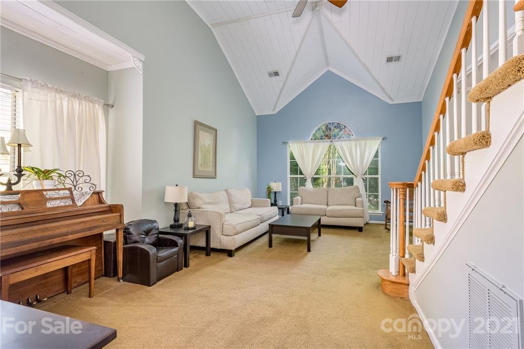 7335 Reedy Creek Road, Unit 25 Charlotte, NC 28215 - Photo 7 of 28 a living room with furniture fireplace and a window
