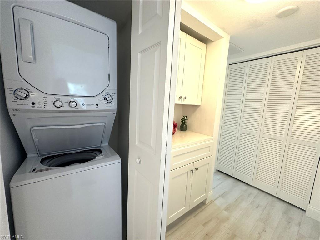 175 5th Avenue South, Unit 103 Naples, FL 34102 - Photo 11 of 18 a utility room with dryer and washer