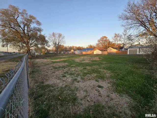 a view of a backyard of the house