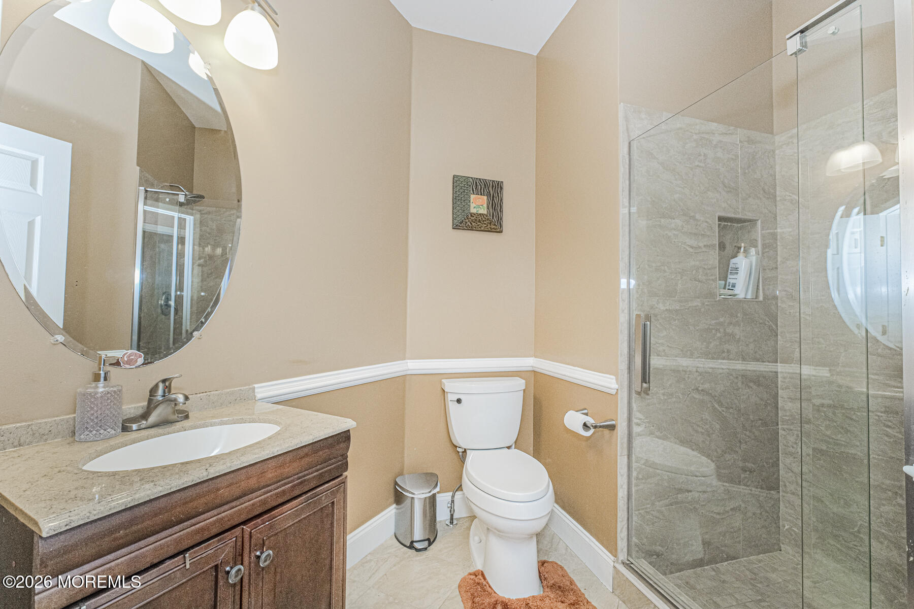 315 Wedgewood Road Morganville, NJ 07751 - Photo 18 of 37 a bathroom with a granite countertop sink mirror vanity and toilet
