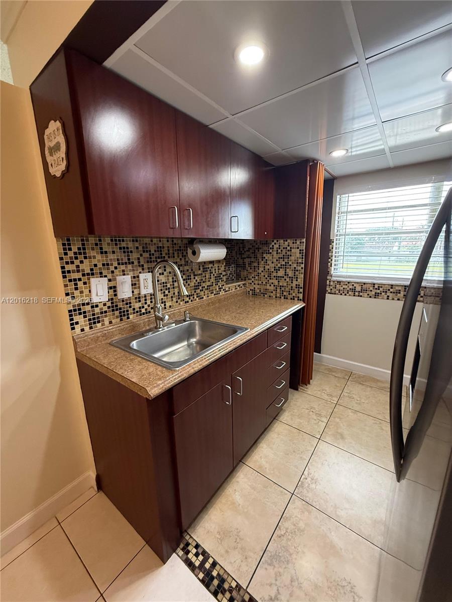 9321 Southwest 4th Street, Unit 230C Miami, FL 33174 - Photo 17 of 37 a bathroom with a sink vanity and a mirror