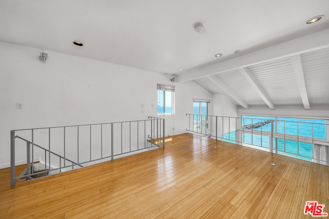 615 Esplanade, Unit 401 Redondo Beach, CA 90277 - Photo 11 of 19 a view of an empty room with wooden floor