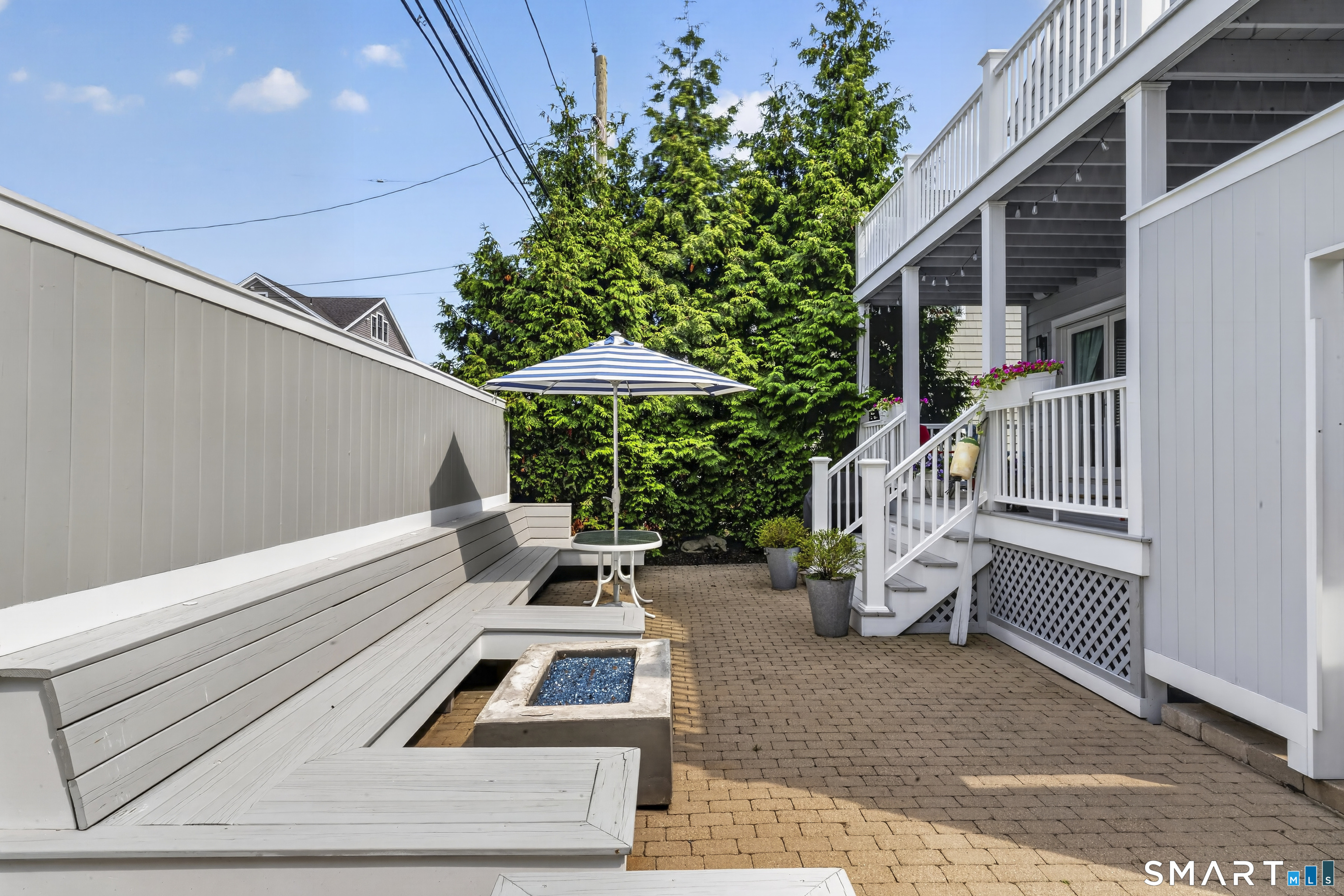 679 Fairfield Beach Road, Unit 679 Fairfield, CT 06824 - Photo 33 of 38 Custom bench seating and propane fire pit.