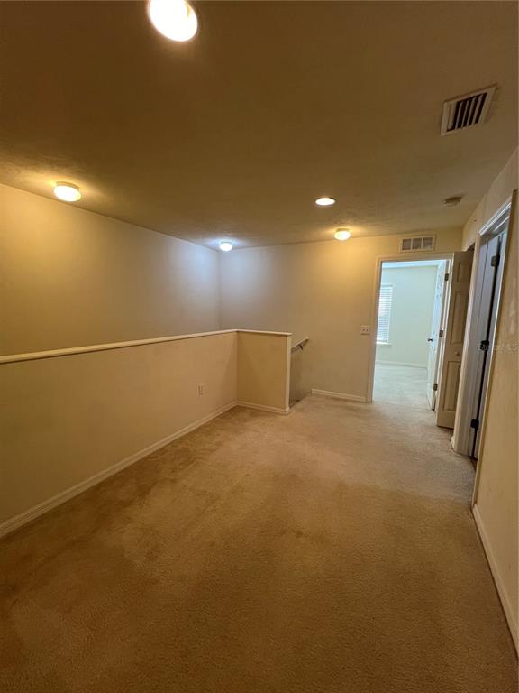 1569 Northwest 29 Road, Unit 3 Gainesville, FL 32605 - Photo 11 of 14 a view of an empty room