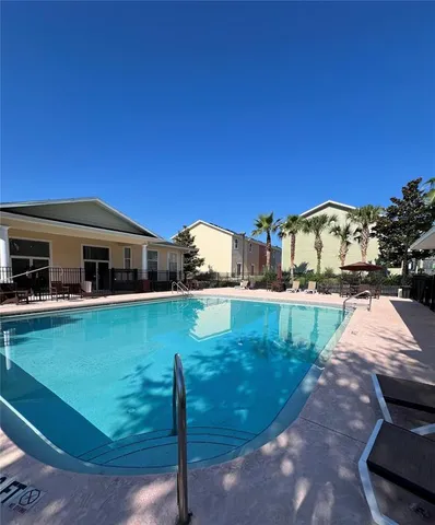 a view of swimming pool with a yard