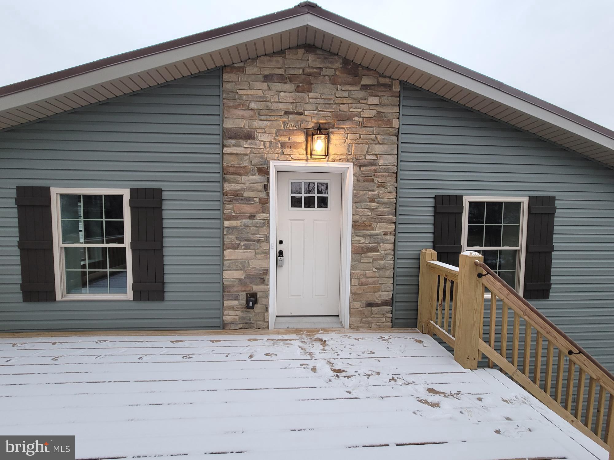 319 West 4th Street, Unit C Waynesboro, PA 17268 - Photo 1 of 1 a front view of a house with glass windows and garage