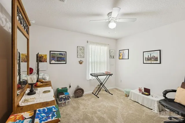 a living room with furniture and white walls