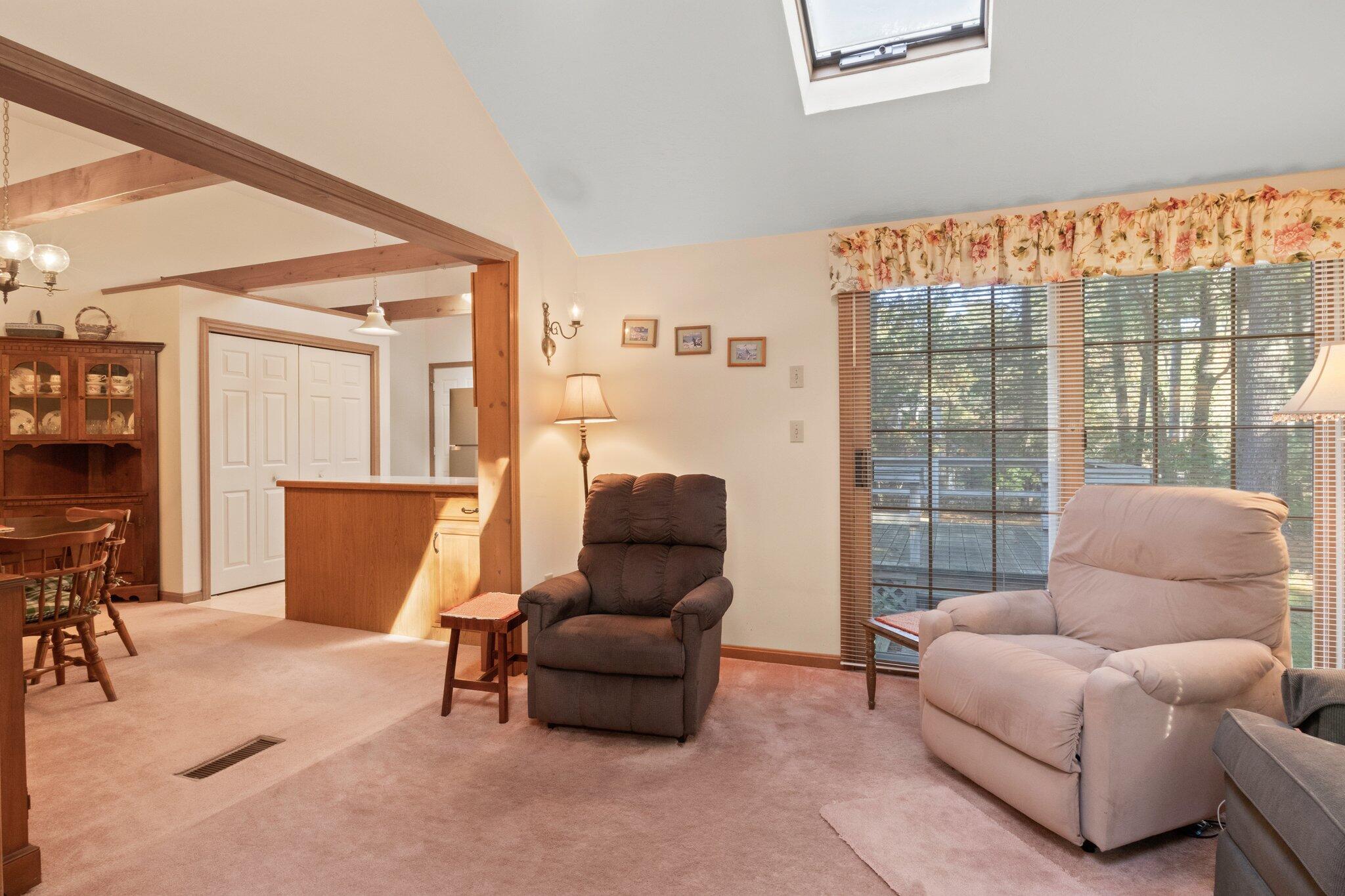 196 Eisenhower Drive Cotuit, MA 02635 - Photo 16 of 33 a living room with furniture and a window