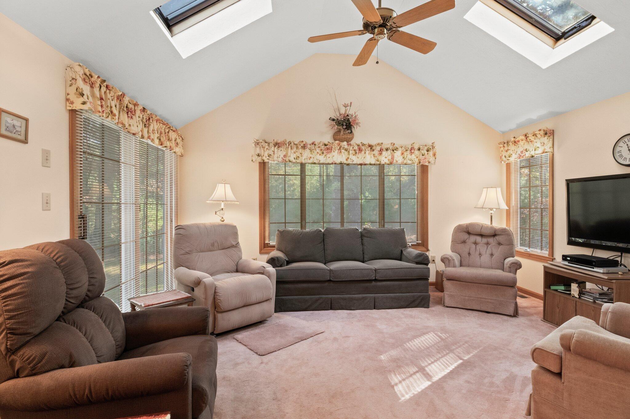 196 Eisenhower Drive Cotuit, MA 02635 - Photo 17 of 33 a living room with furniture a ceiling fan and a window
