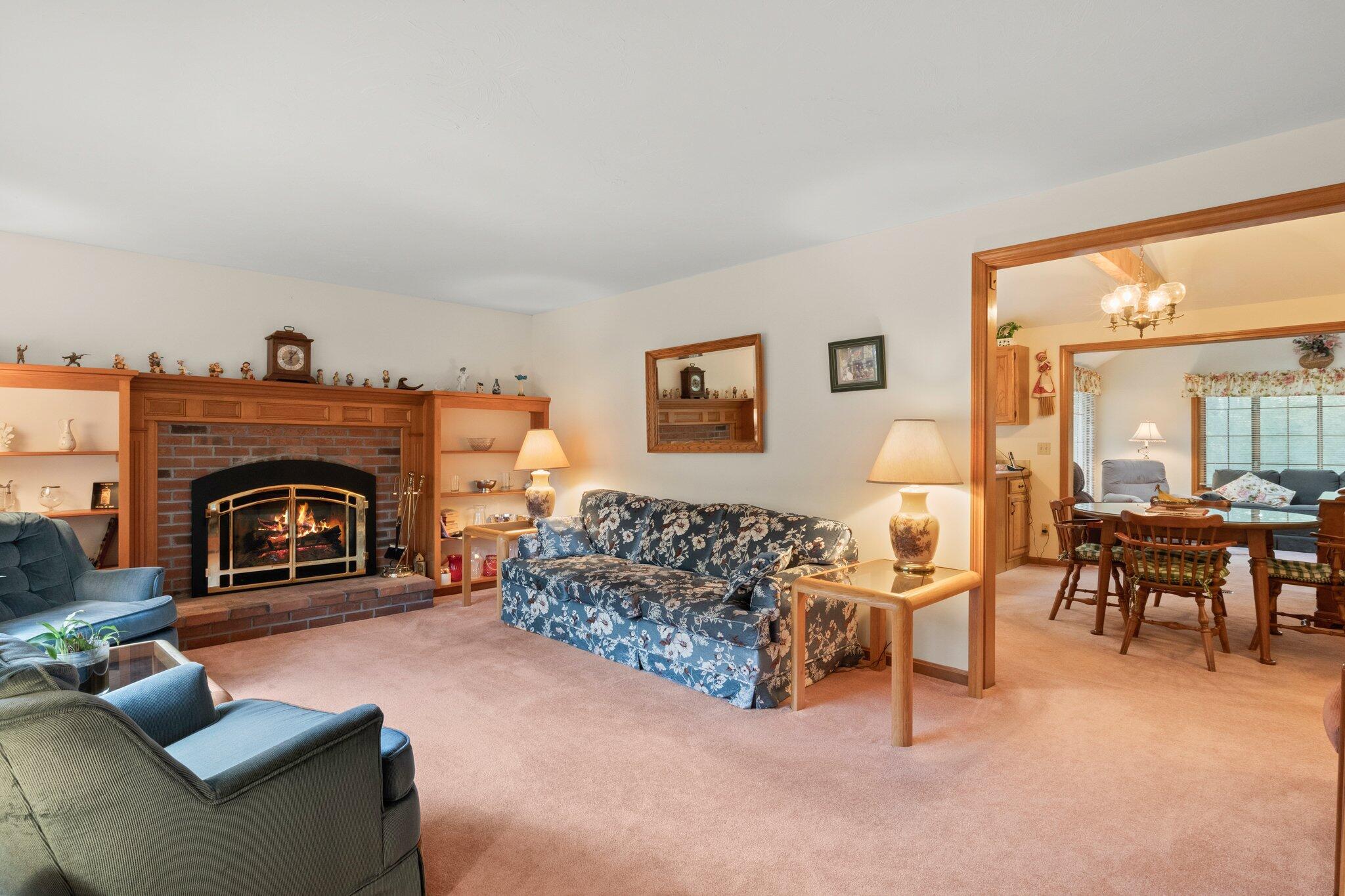 196 Eisenhower Drive Cotuit, MA 02635 - Photo 5 of 33 a living room with furniture and a fireplace