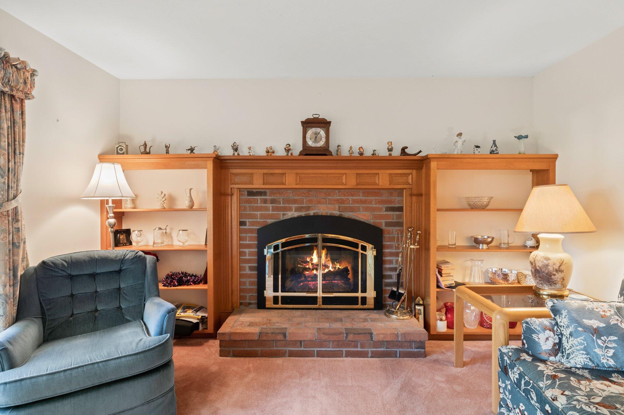 196 Eisenhower Drive Cotuit, MA 02635 - Photo 8 of 33 a living room with furniture and a fireplace