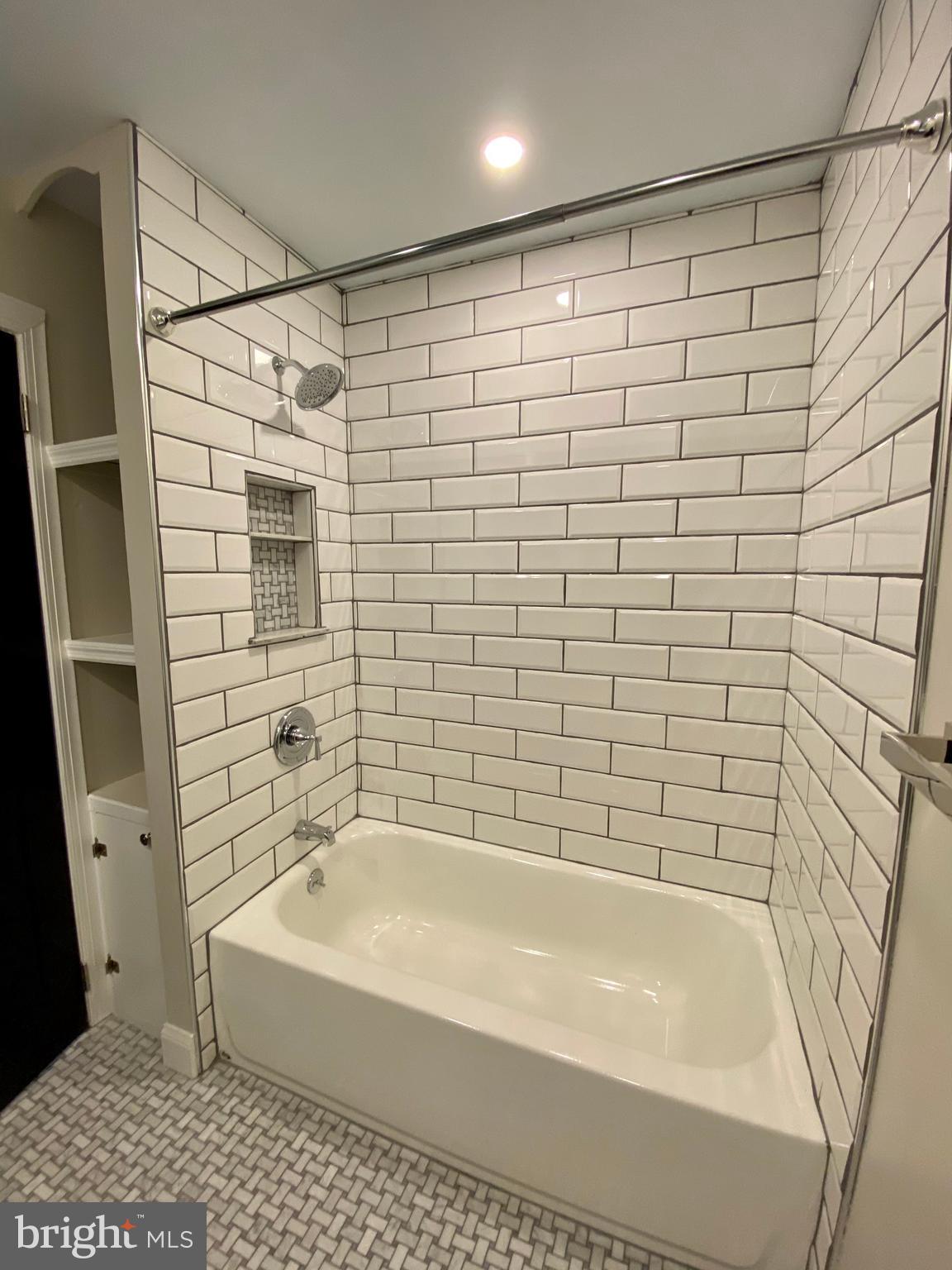 2417 Shellpot Drive Wilmington, DE 19803 - Photo 12 of 18 a bathroom with a bathtub and a shower