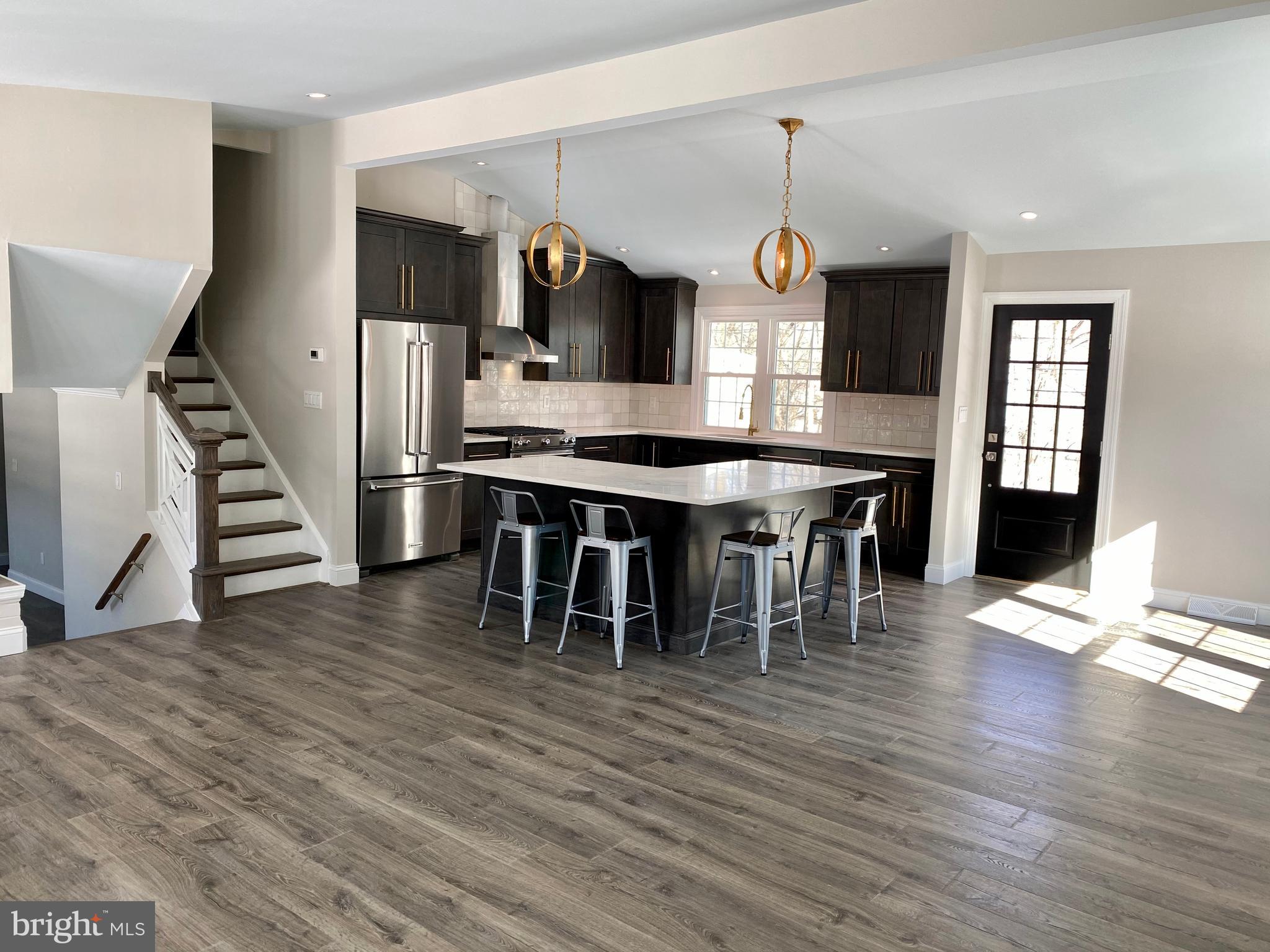 2417 Shellpot Drive Wilmington, DE 19803 - Photo 3 of 18 a view of a dining room with furniture window and wooden floor