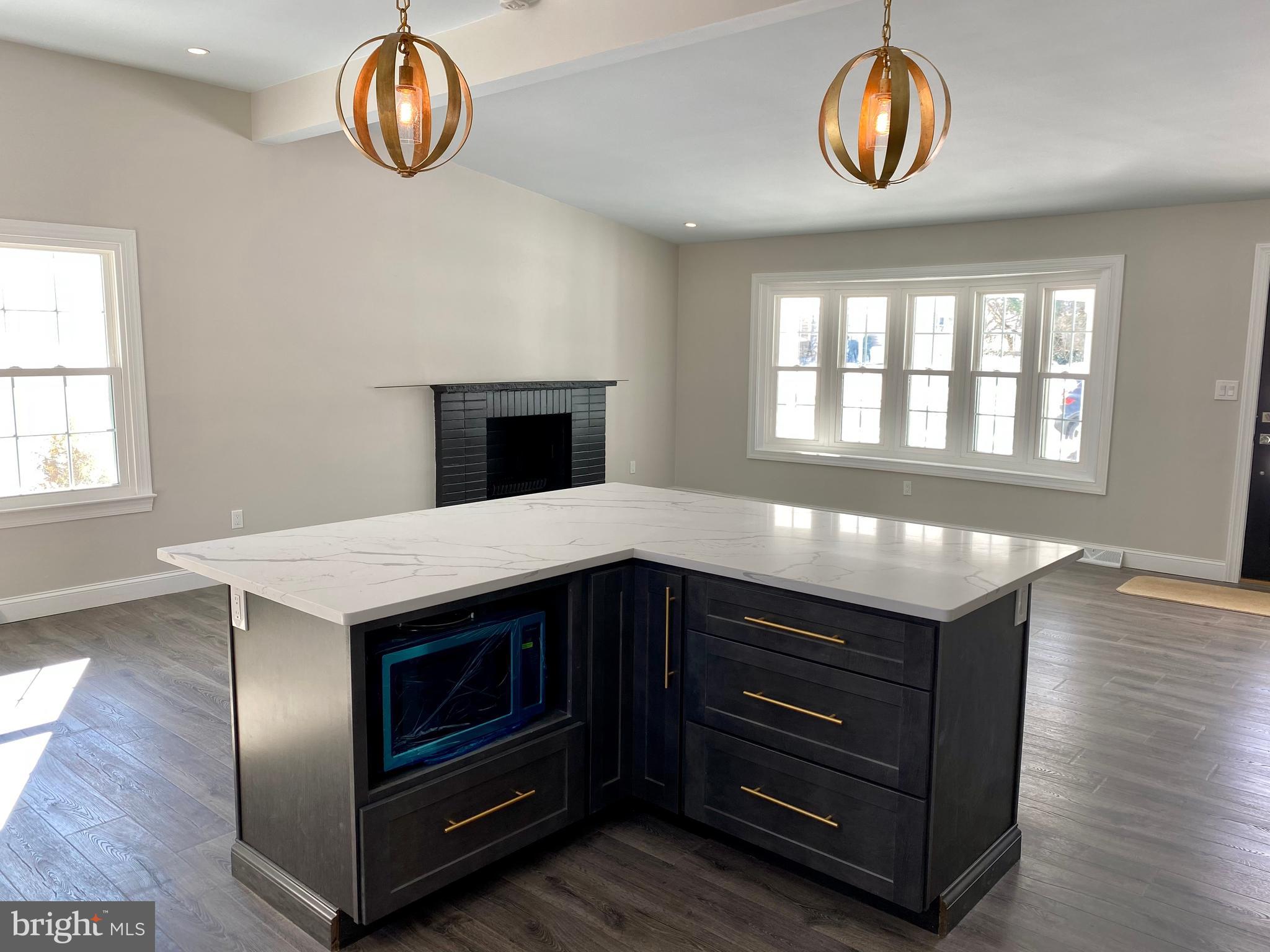 2417 Shellpot Drive Wilmington, DE 19803 - Photo 5 of 18 a kitchen with a stove and a microwave