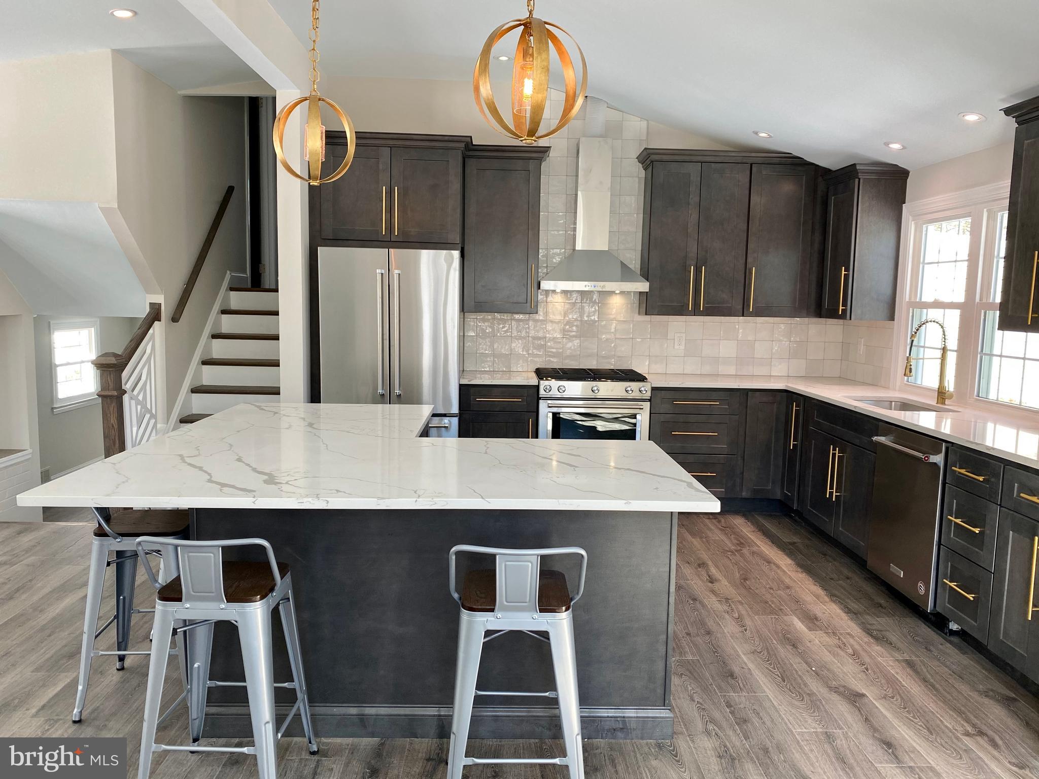 2417 Shellpot Drive Wilmington, DE 19803 - Photo 7 of 18 a kitchen with cabinets table and chairs