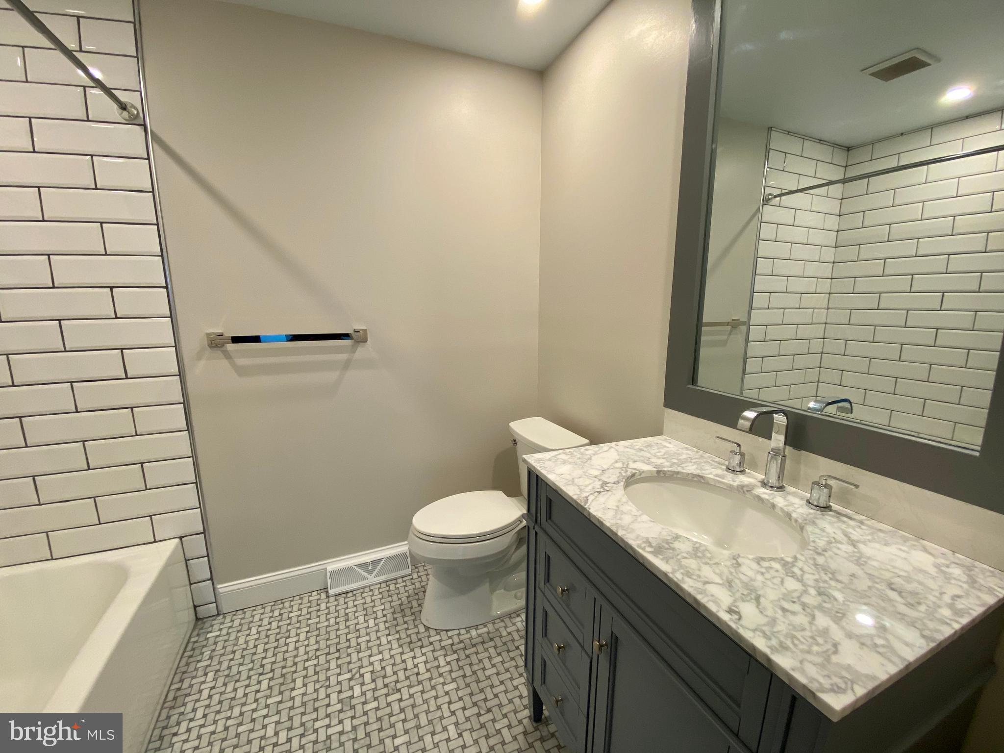 2417 Shellpot Drive Wilmington, DE 19803 - Photo 10 of 18 a bathroom with a granite countertop sink toilet and shower