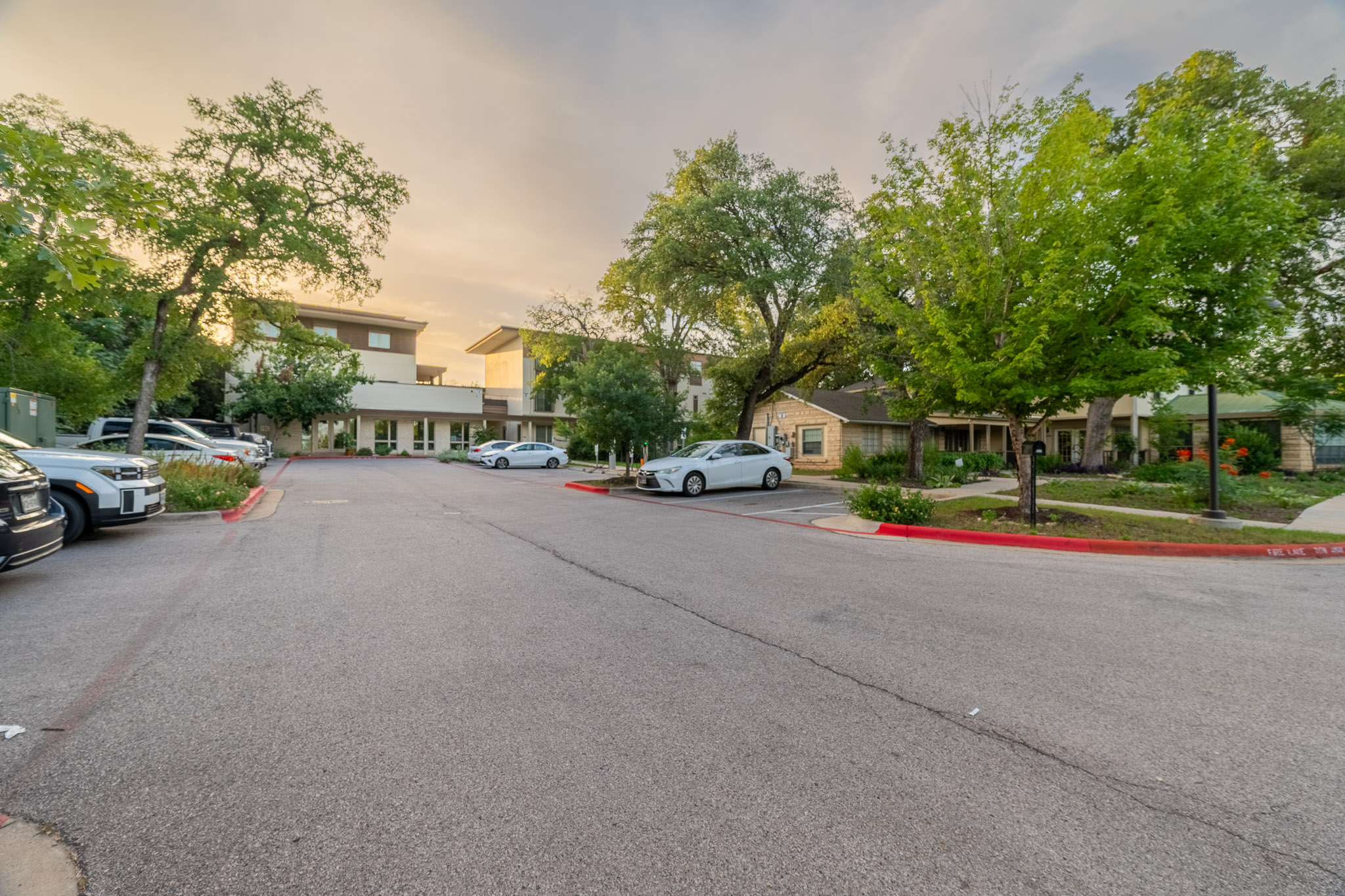 6700 Menchaca Road, Unit 24 Austin, TX 78745 - Photo 17 of 18 View of asphalt street featuring a residential view and curbs