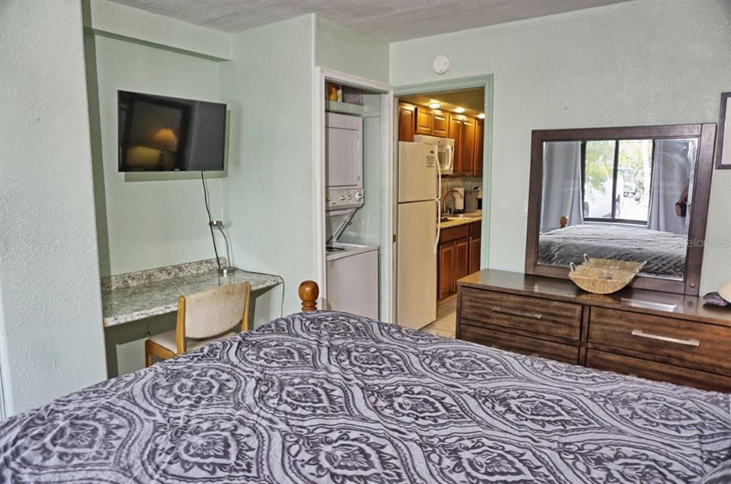 20921 Haulover Cove Road, Unit F5 Lutz, FL 33558 - Photo 17 of 34 a living room with furniture and a flat screen tv