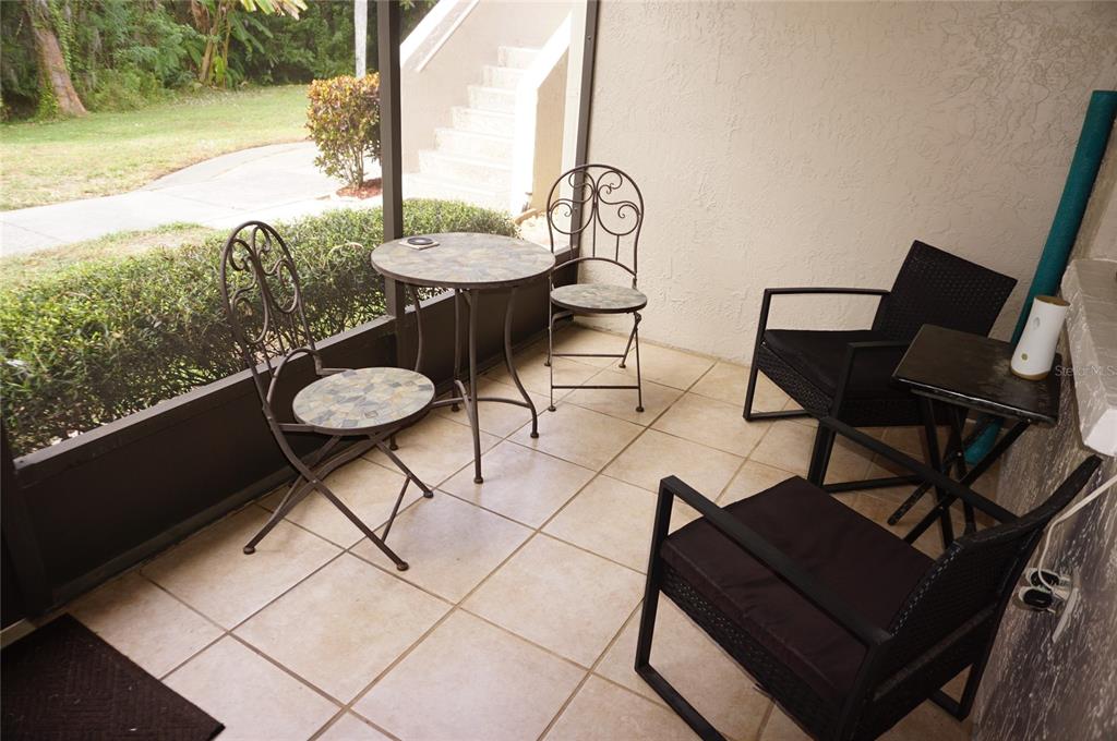 20921 Haulover Cove Road, Unit F5 Lutz, FL 33558 - Photo 24 of 34 a outdoor view with a sitting space