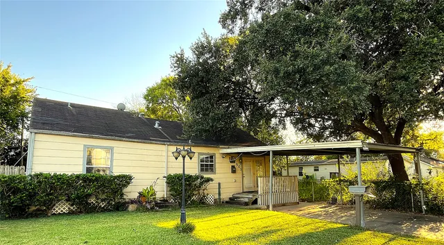 a view of a backyard with swimming pool