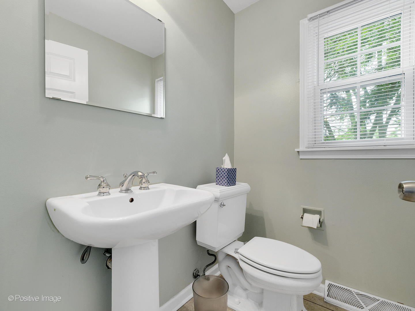 800 West Roosevelt Road Wheaton, IL 60187 - Photo 15 of 28 a bathroom with a sink a toilet and mirror