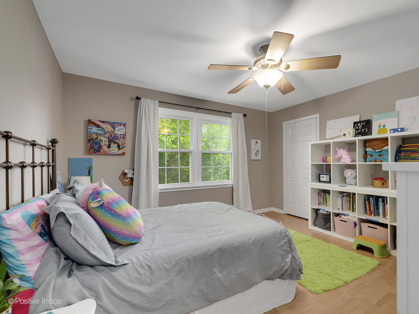 800 West Roosevelt Road Wheaton, IL 60187 - Photo 20 of 28 a bedroom with a bed and a book shelf