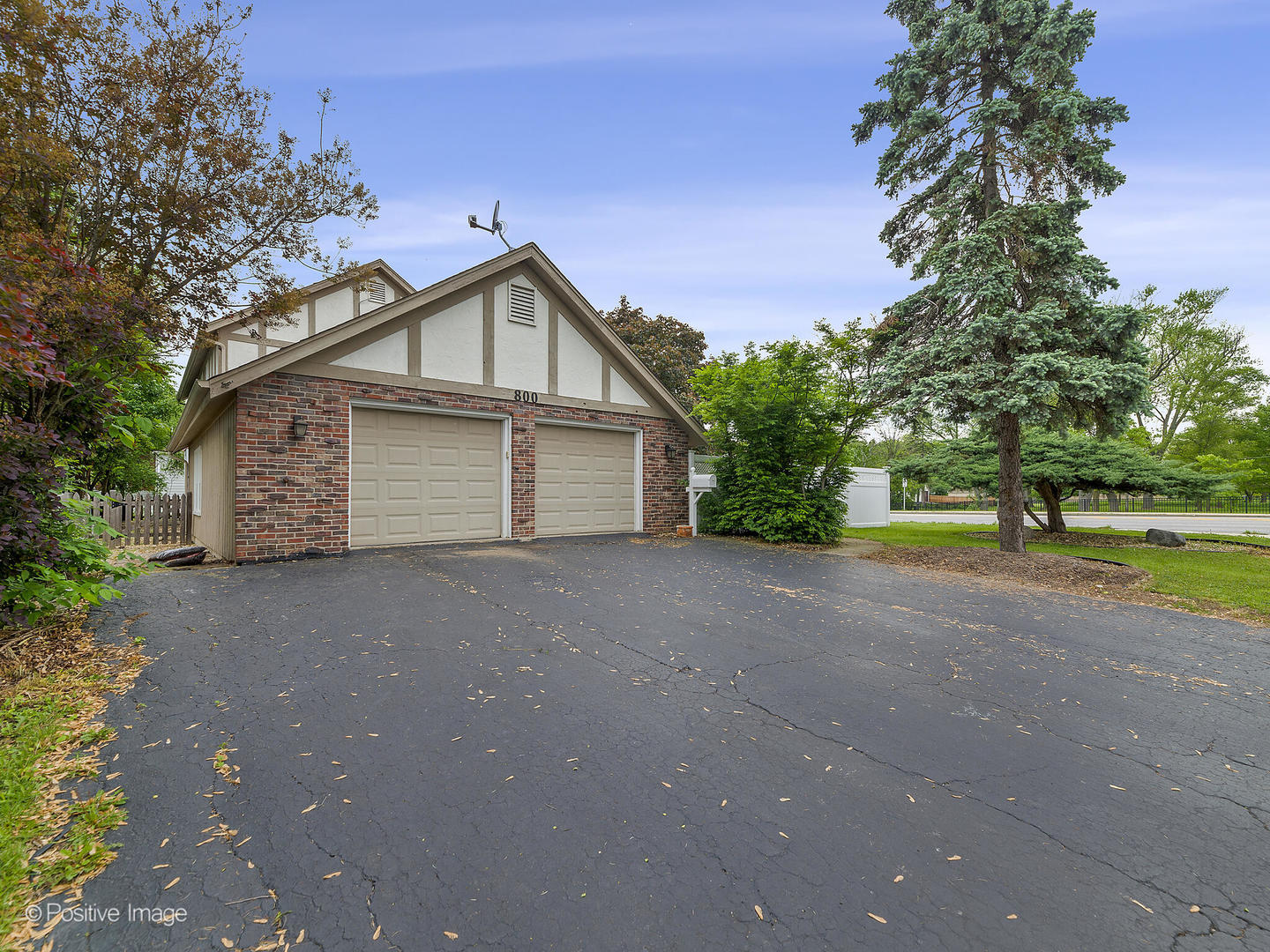 800 West Roosevelt Road Wheaton, IL 60187 - Photo 28 of 28 a view of a house with a yard and garage