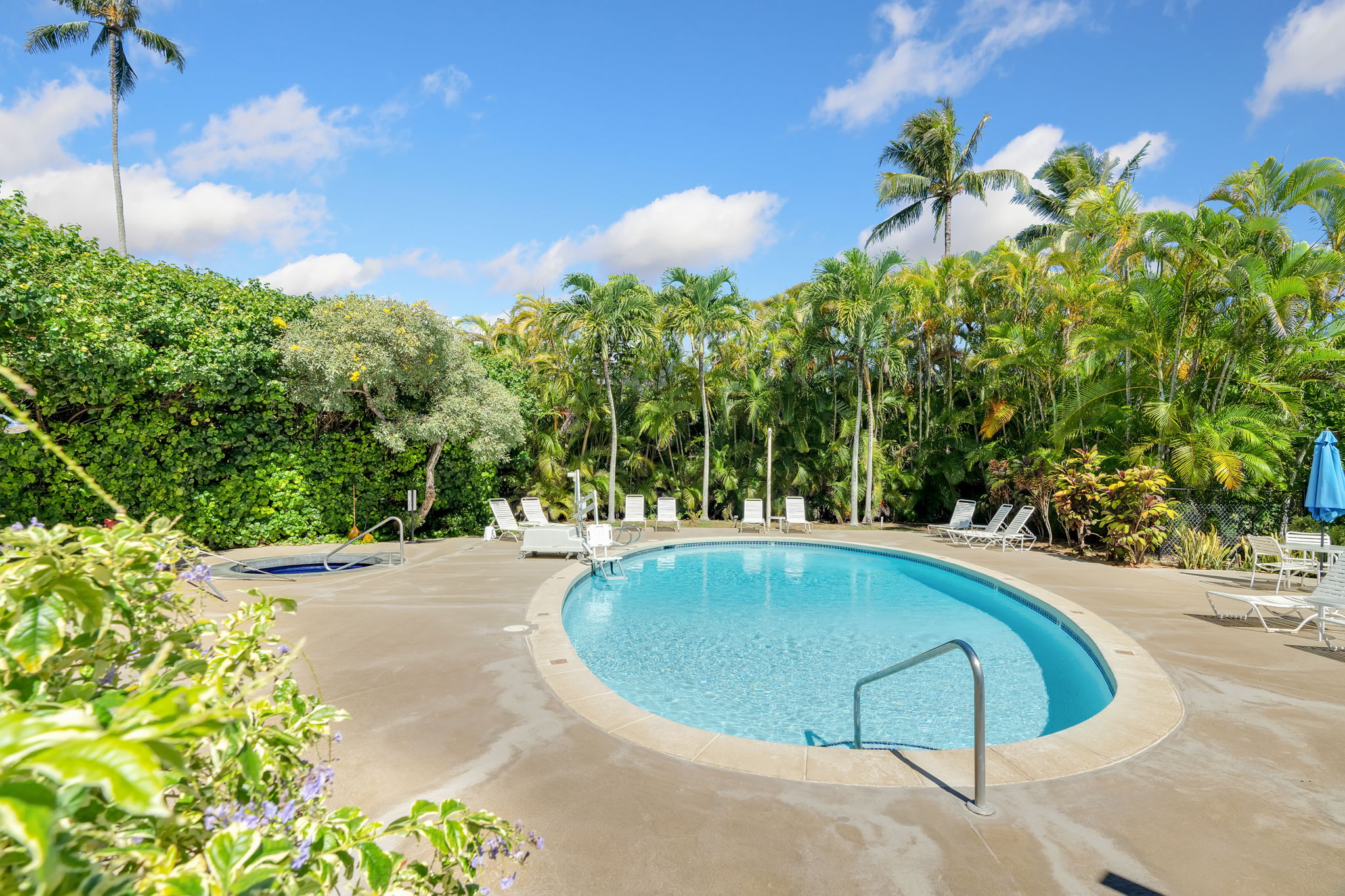525 Aleka Loop, Unit H7 Kapaa, HI 96746 - Photo 21 of 30 a view of a swimming pool with a yard