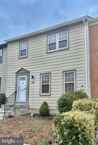 a backyard of a house with garden and barbeque oven