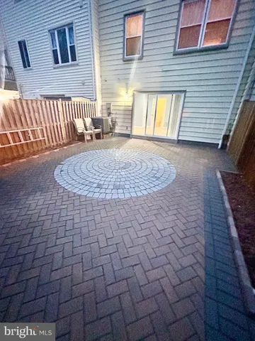 a view of a brick house with many windows