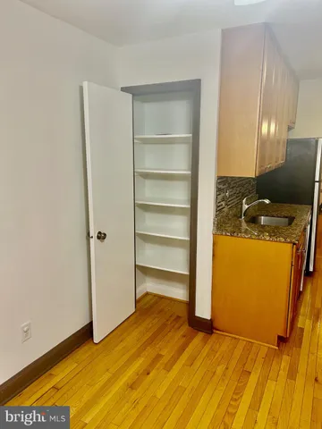 a view of a room with storage and utility room