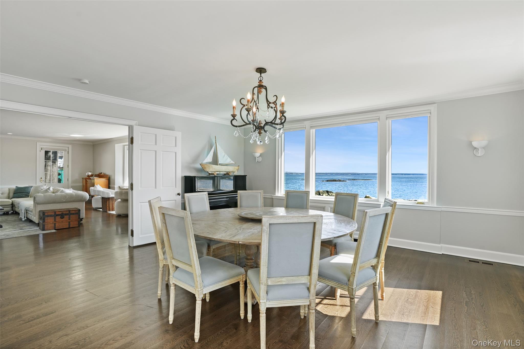 6 Pine Island Road Rye, NY 10580 - Photo 14 of 38 a view of a dining room with furniture window and wooden floor
