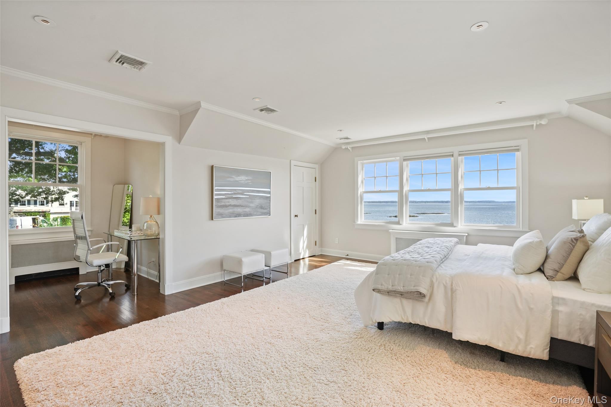 6 Pine Island Road Rye, NY 10580 - Photo 17 of 38 a bedroom with a bed a table and large windows