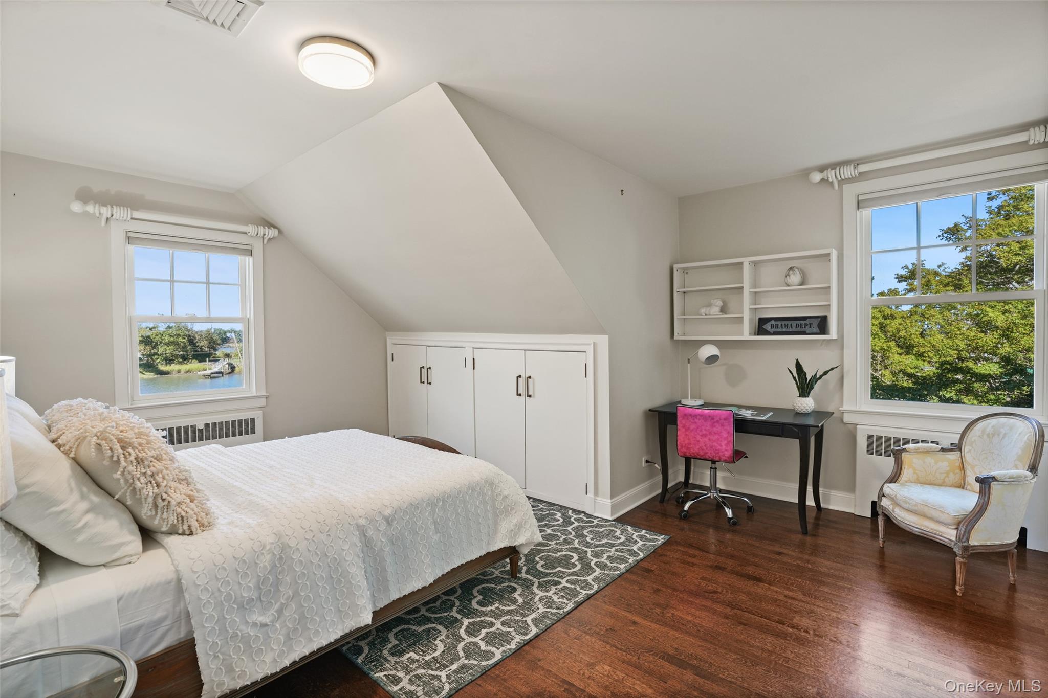 6 Pine Island Road Rye, NY 10580 - Photo 22 of 38 a bedroom with a bed chair and a window